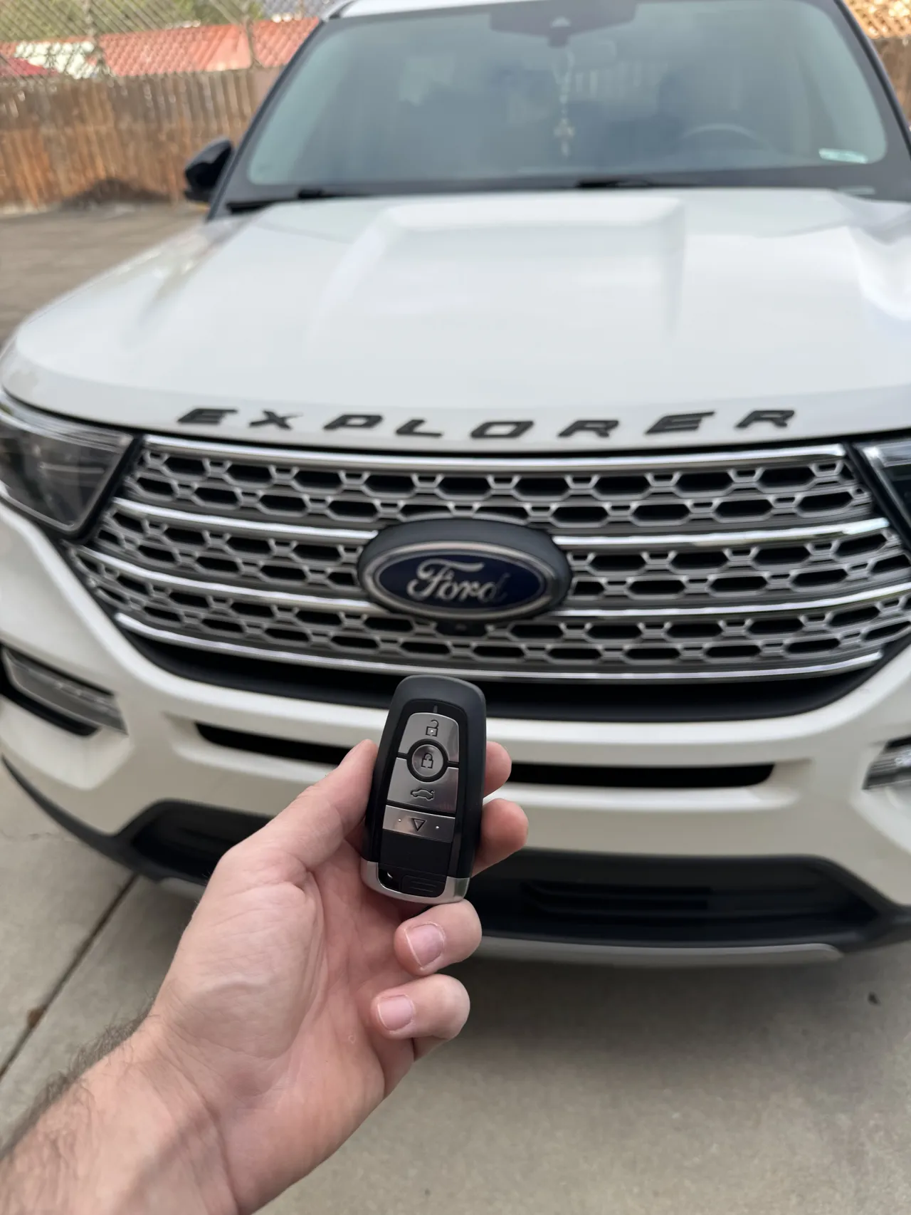 Hand holding a Ford Explorer key fob